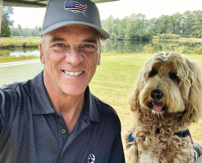 Ken Gestring enjoys golfing with his service dog, Meli.