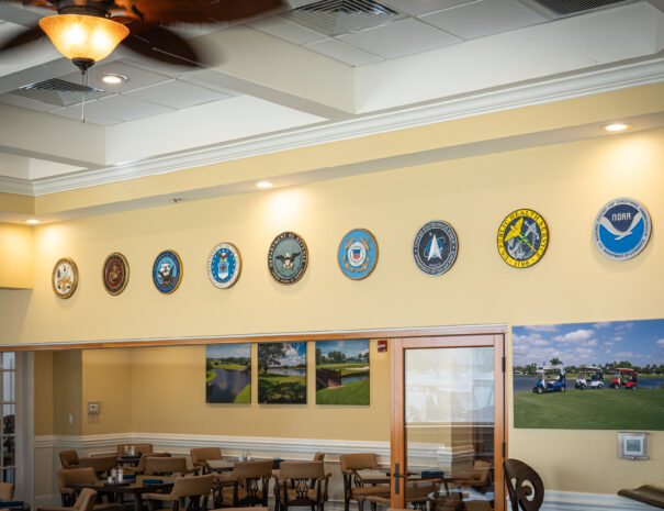 US Military Service emblems shown on the wall of the 19th Hole Lounge
